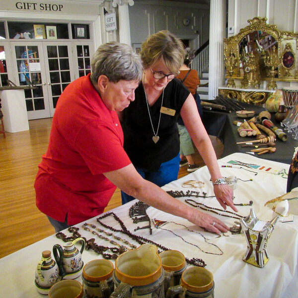 Board of Directors and guests welcome Sue Koenig's Window to the World to the IMOA
