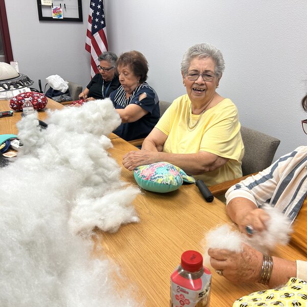 Our amazing volunteers creating pillows with love for our patients. 