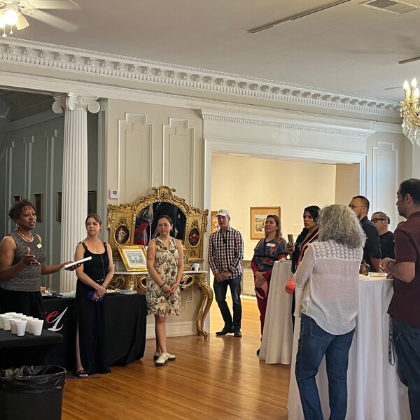 Community members and local business owners gather for a Meeting at the Mansion