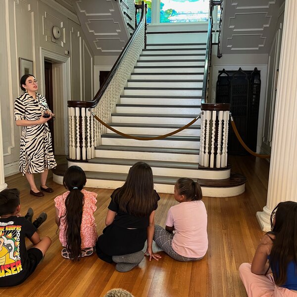 Students listen to the story of the founding of our Museum inside our beautiful Historic Home 