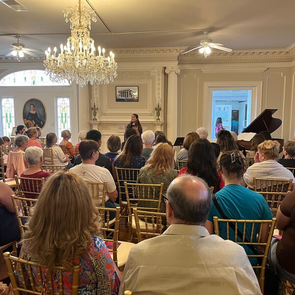 Guests spend a relaxing afternoon at "Music 4 Women," with live piano music from local musicians 