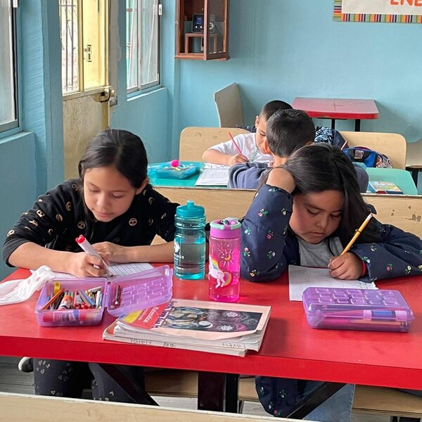 Girls doing homework in dining hall