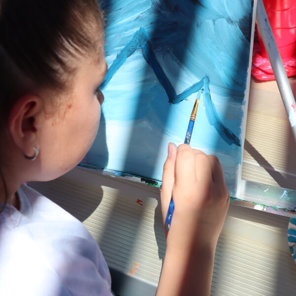 Girl paints her version of the mountains during our Franking Mountains artmaker camp.